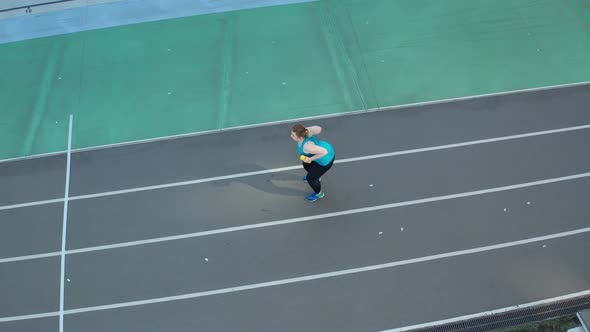 Drone Shot of Plus Size Female Exercising Outdoors