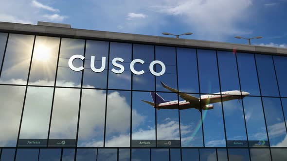Airplane landing at Cusco Peru airport mirrored in terminal
