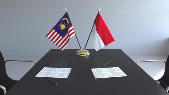 Flags of Malaysia and Indonesia and Papers