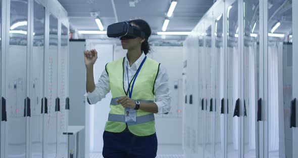 Female Electrical Worker Using a VR Headset