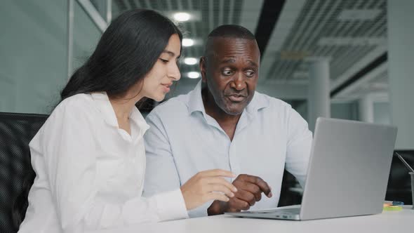 Two Diverse Colleagues Businesspeople African Senior Man Lawyer and Arabian Woman Worker Sit in