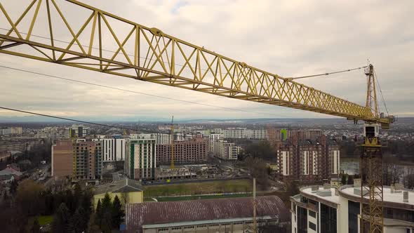 Aerial Footage of a Tower Crane at Construction Site of New Office Building