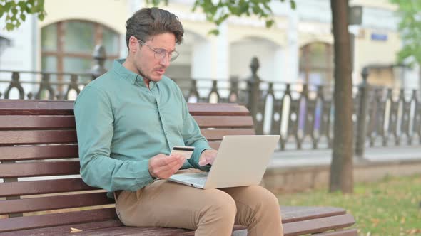 Man making Successful Online Payment on Laptop