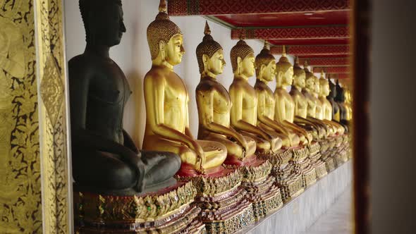 Gold Buddha Statue in Bangkok, Thailand, Lots of Buddhist Statues in a Row at Beautiful Temple for B