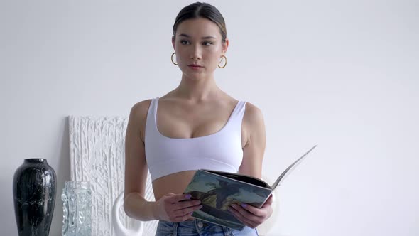 Aesthetic Photoshoot Of A Lady In White Bralette Top. Medium Shot