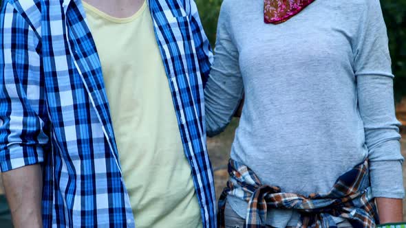 Portrait of smiling couple standing with arm around