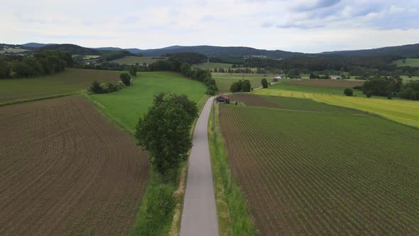 Rural Agricultural Landscape For Farming, Fields end Forest - Aerial Drone Footage