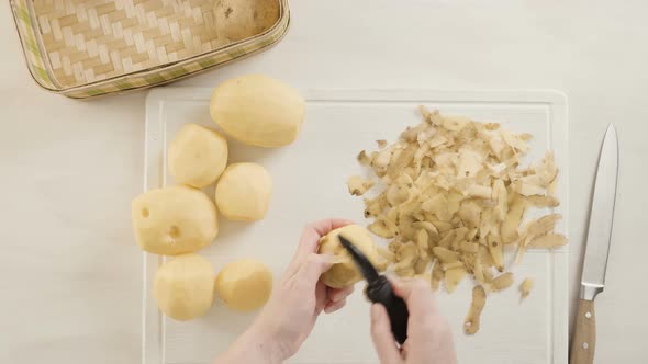 Step by step. Peeling Yukon gold potatoes for classic mashed potatoes.