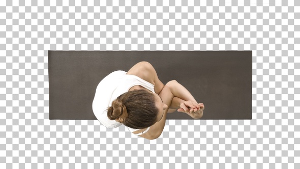 Beautiful young woman doing yoga exercise for ankles calves,