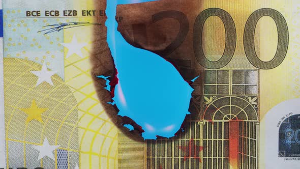 Burning of 200 Euro Banknote on Chroma Key Bacground Closeup