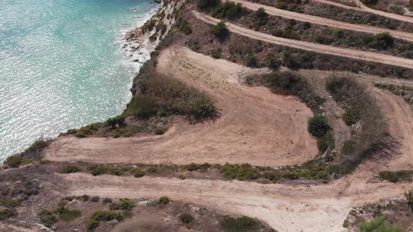 Aerial drone video from eastern Malta, Marsaxlokk area, Il-Hofra l-Kbira bay.