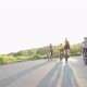 Four cyclists riding along road - VideoHive Item for Sale