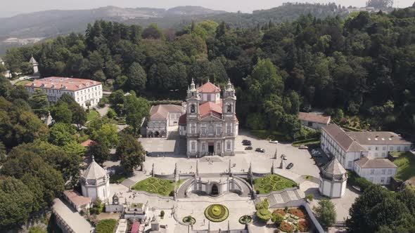 Top down rotation over Famous Bom Jesus Church on top of hill surrounded by Nature