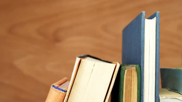 Various books arranged on a table