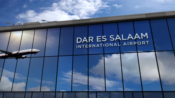 Airplane landing at Dar es Salaam Tanzania airport mirrored in terminal