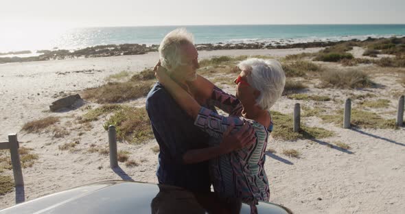 Senior couple hugging at the beach