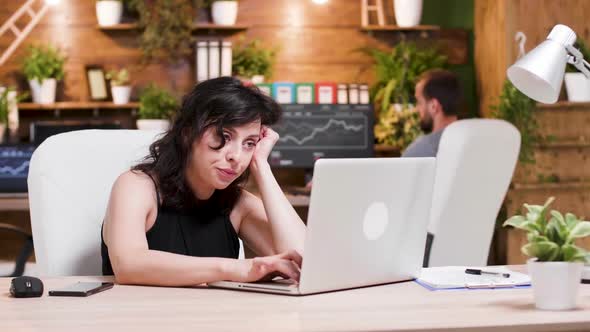 Tired Businesswoman Works in Cozy Office