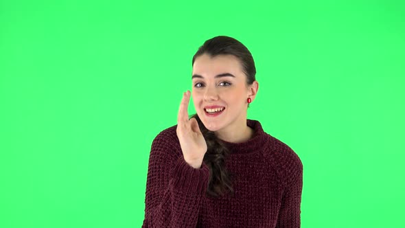 Girl Screams Calling Someone on a Green Screen at Studio. Green Screen