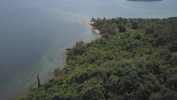 Aerial views of fishing village on Koh Tonsay (Rabbit Island) in Cambodia. Camera starts down and ti