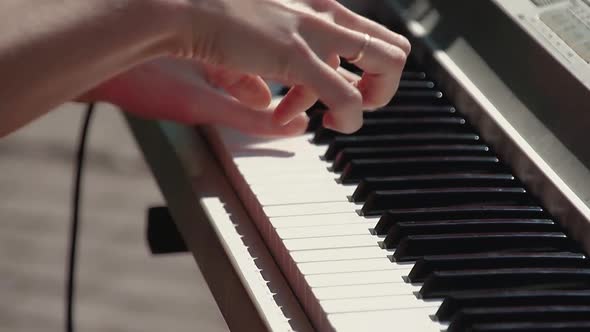 Pianist Plays the Synthesizer As Part of the Band