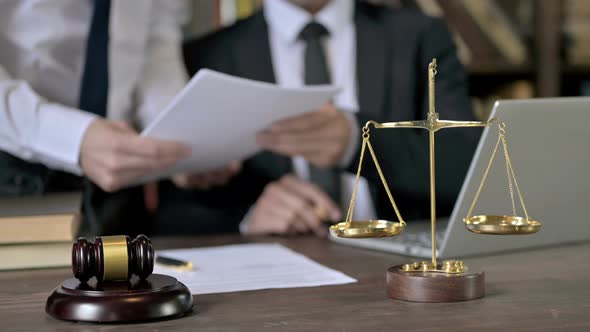 Close Up Shoot of Judge Hand Checking the Document in Court Room