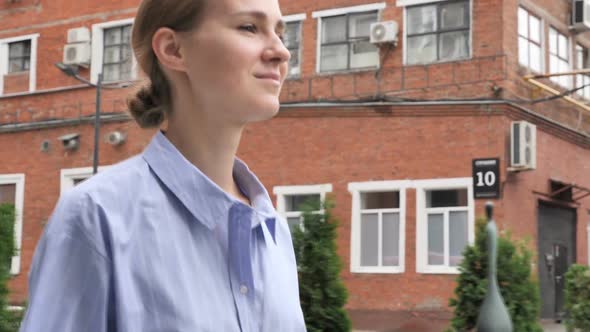 Casual Woman Walking on Street