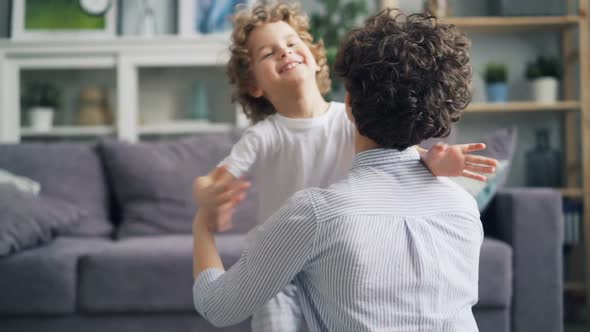 Slow Motion of Beautiful Little Boy Emrbacing Mother with Love and Tenderness