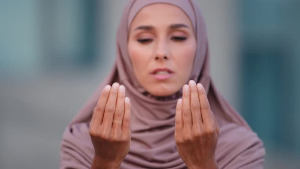 Close Up Female Face Serious Muslim Woman Wears Beige Hijab Traditional Clothing Praying Outdoors in