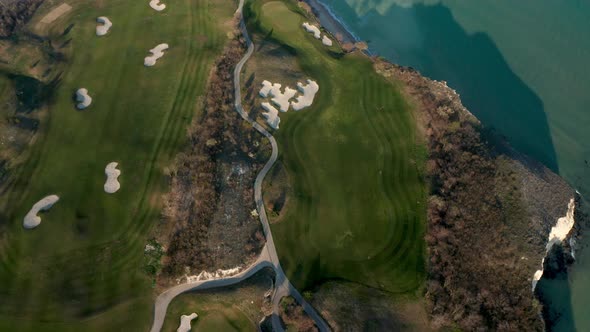 Top view of beach resort with golf fields