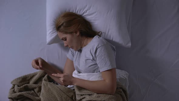 Sad Woman Looking at Beloved Man Picture Before Sleeping, Missing Him, Top-View