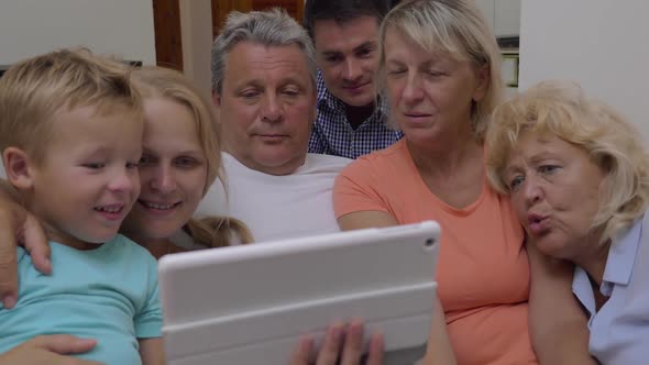 Family Watching Video on Tablet Computer