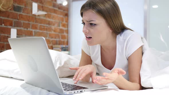 Angry Frustrated Woman Yelling while Working on Laptop