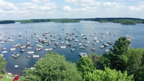 Lake crowded with spring break party boats during college spring summer break. Aerial