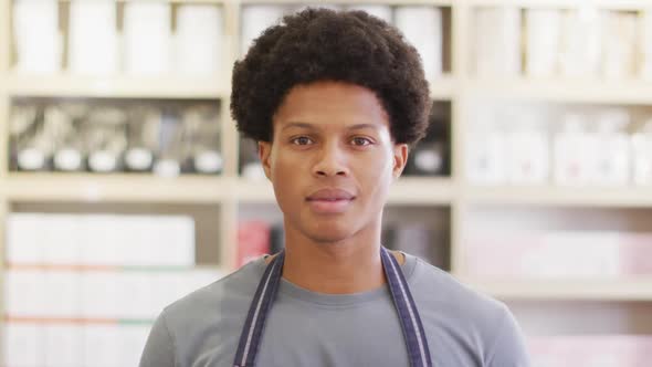 Animation of happy biracial waiter standing in coffee shop