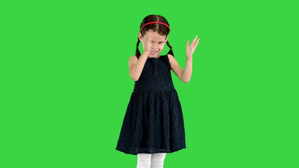 Delighted Girl in Black Dress Clapping Her Hands on a Green Screen Chroma Key