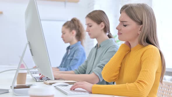 Young Creative Woman Working on Desktop and Having Neck Pain