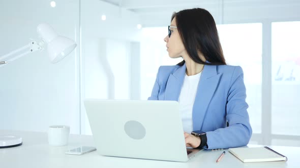 Woman Waiting for Meeting, Watching Time on Smartwatch