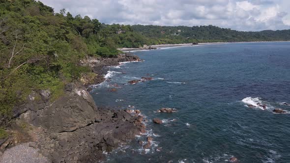 bird's eye view of the rocky coastline where the Pacific Ocean meets the shores of Costa Rica