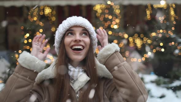 Girl Having Fun on the Street Snowfall