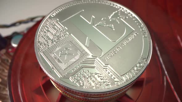 Silver Crypto Coin Lite Coin Is Rotating on Red Surface. Digital Cryptocurrency. Blockchain