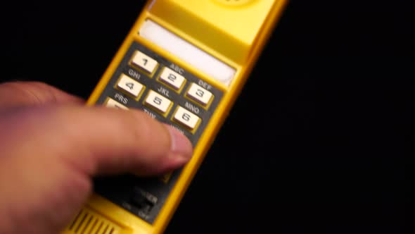 Dialing 911 on Vintage Speed Dial Telephone Device From 1980s Close Up