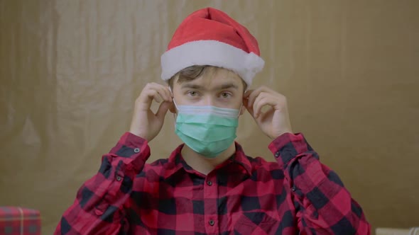 Guy in Santa Hat Takes Off His Medical Mask