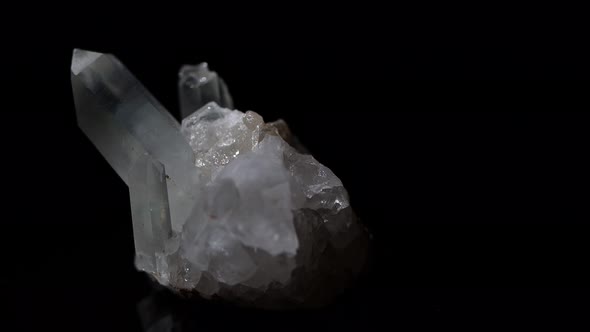Quartz crystals emerge from a piece of stone. Ghostly in appearance.