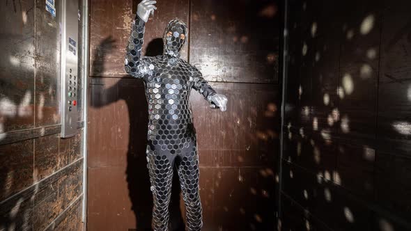 Sparkling Discosuit Man Dancing in a Lift