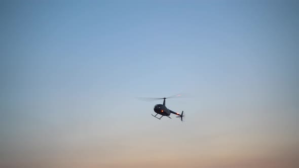 Helicopter Flying in the Blue Sky