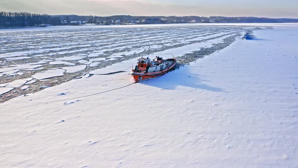 Icebreakers on Vistula river. Aerial view of nature in winter.