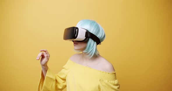 An Young Pretty Woman is Using Innovative Technology Vr Glasses for Play Games