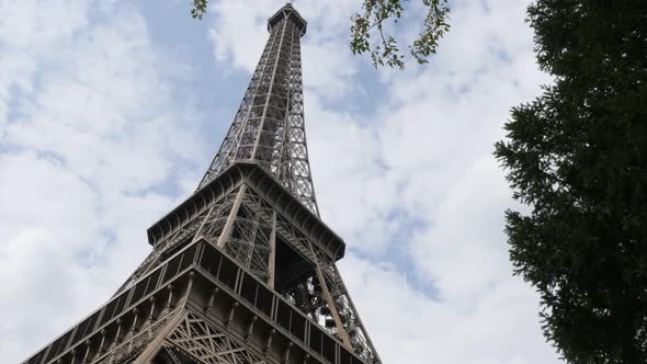 Beautiful  Eiffel tower construction in front of cloudy Parisian sky 4K 3840X2160 UltraHD footage - 