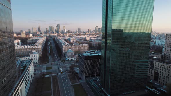 Scenic aerial view from above of Warsaw city in Poland at sunset between buildings. From Gdański Bus