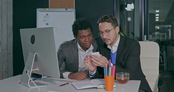 Business Man and African Meeting and Talking in the Office